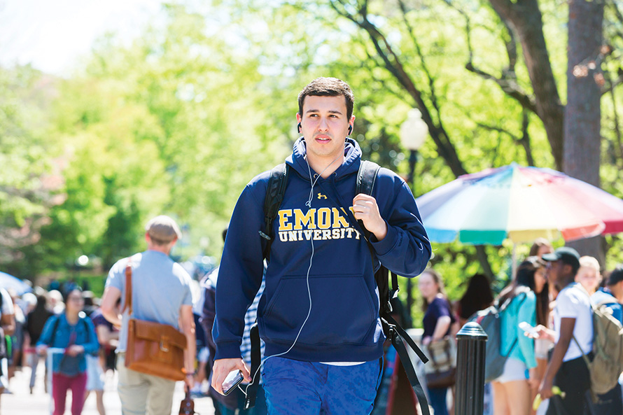 student walks through Asbury Circle